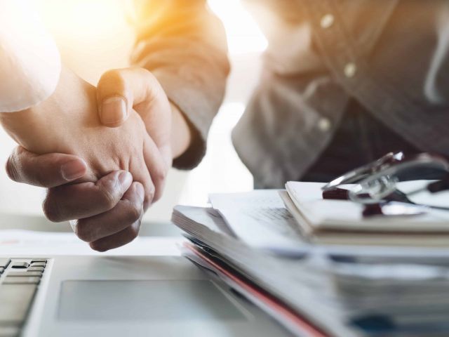 Close up of Business people shaking hands, finishing up meeting, business etiquette, congratulation, merger and acquisition concept